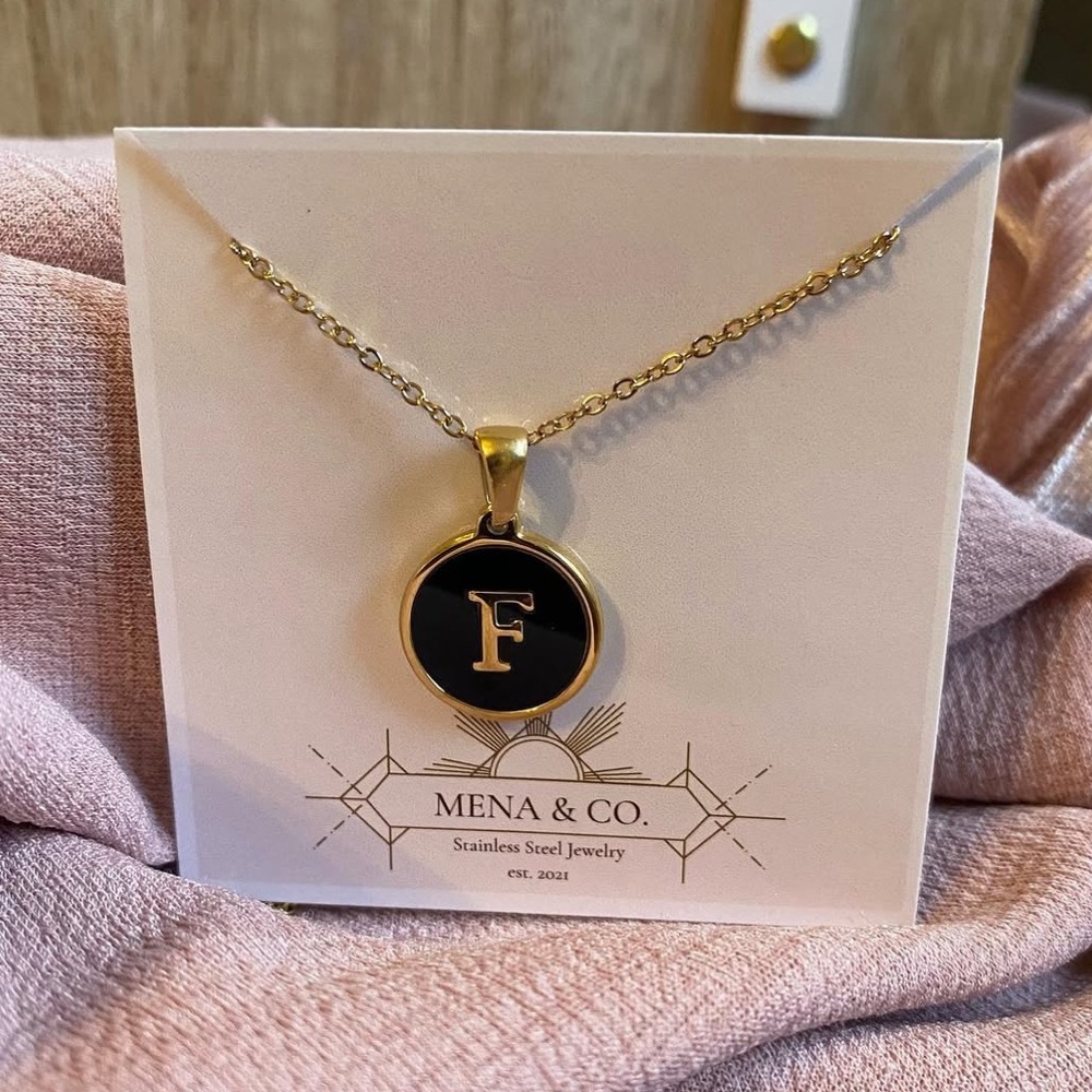 Stainless Steel Gold Initial Necklace Letter “F” with a black inlay.